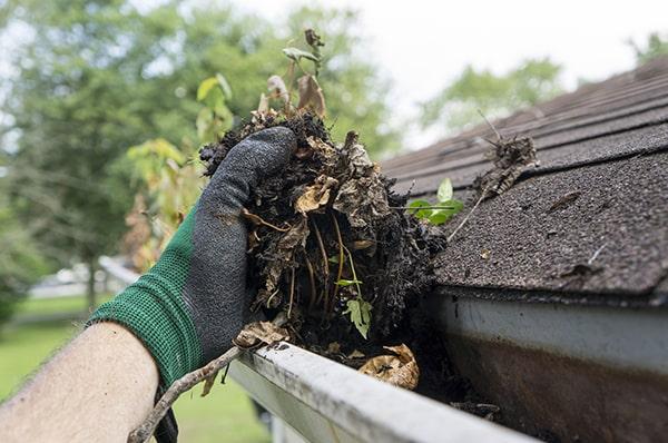 overflowing water, visible debris, and sagging gutters are all signs that it's time for gutter cleaning